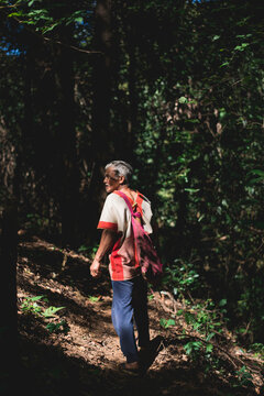 Senior Karen man walking in the forest