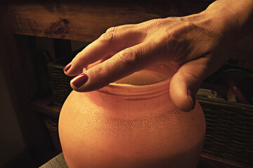 hand over pot of sugar