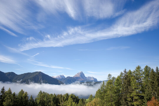 Blue sky over the misty valley