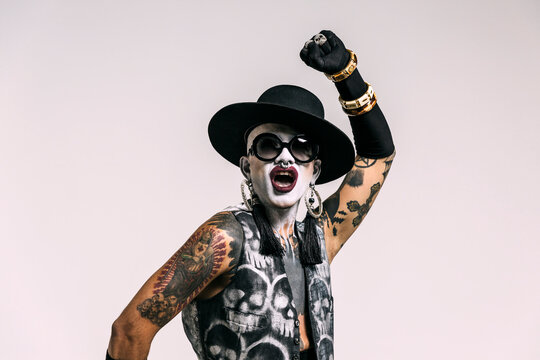 Bizarre fashion studio portrait with extreme makeup
