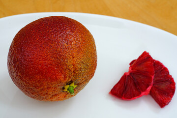 A blood orange with red and orange skin