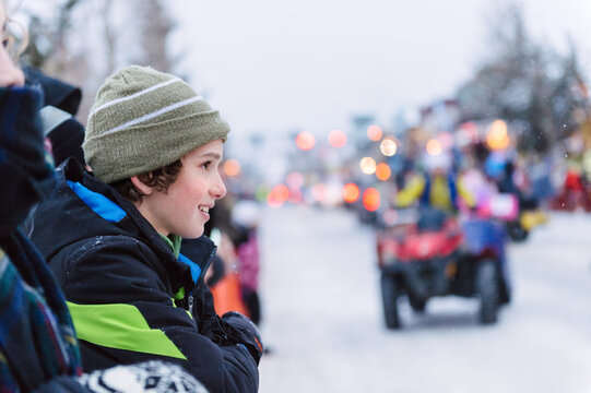 Boy watching a parade in winter