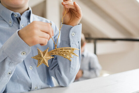 Little boy holding Christmas decoration