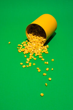 Canned sweet corn on green background
