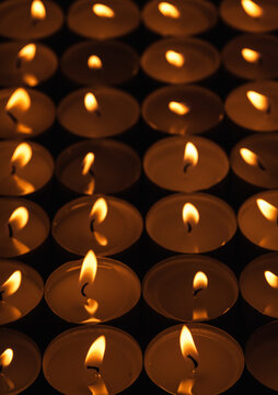 Candles burning in the darkness
