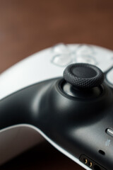 Fototapeta na wymiar Closeup of a white modern video games controller on a table 