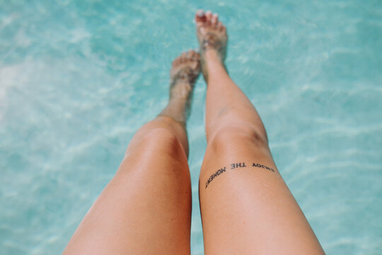 Woman legs in the pool