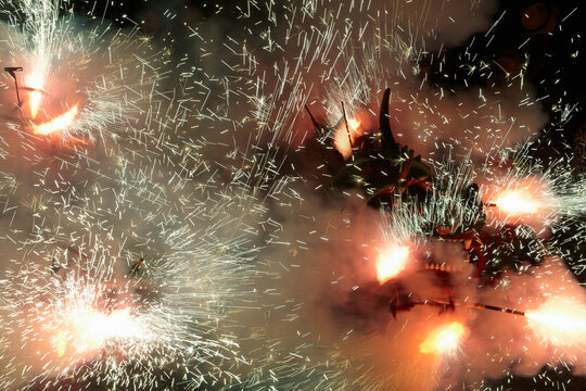 Dragon comming out of a cloud of smoke and sparks