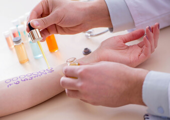 Doctor testing allergy reaction of patient in hospital