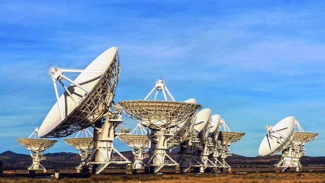 radio telescope,VLA, on desert landscape time lapse