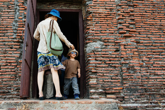 Mother and son explore an old church bell tower
