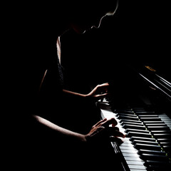 Piano player. Pianist playing grand piano concert