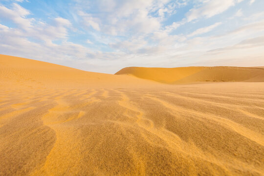 Dunes and blue sky on the desert from a low angle point of view
