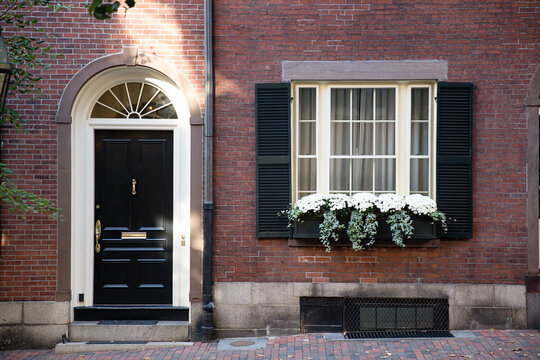 Door and window in brownstone building