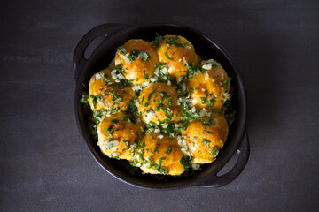 Garlic bread, buns. Bread rolls with garlic and parsley. overhead, horizontal photo