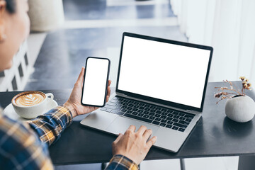 computer screen,cell phone blank mockup.hand woman work using laptop texting mobile.with white...