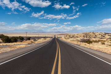 Empty New Mexico highway with endless rural views in the western Untied States. 