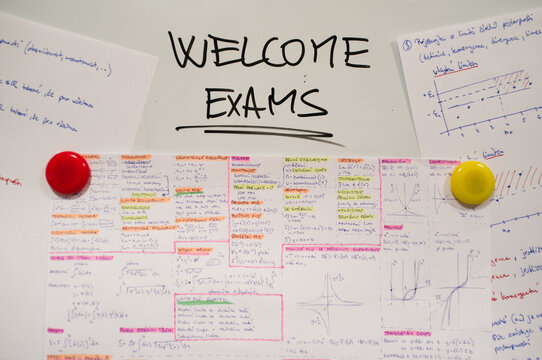 Whiteboard with sign about exams