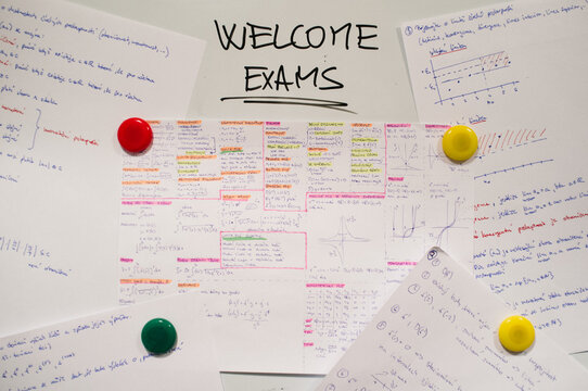 Whiteboard with sign about exams