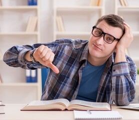 Young student preparing to school exams with books