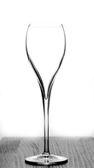 Transparent tall wine glass on a light background