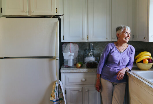 Portrait of senior Woman at Home in Kitchen