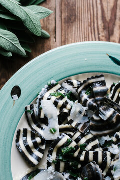 Black and white striped Farfalle pasta with sage butter.