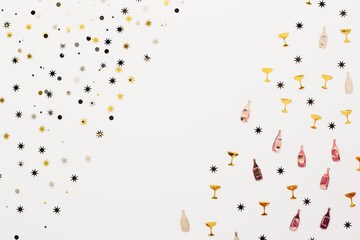 Pattern: one part of glittery stars and other part of glasses and bottles of champagne