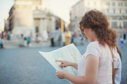 Tourists Looking for Places on a Map