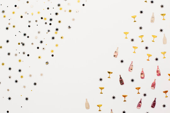 Pattern: one part of glittery stars and other part of glasses and bottles of champagne