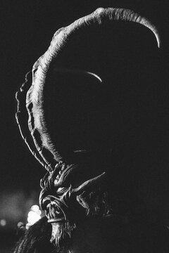 portrait of a krampus with long capricorn horns