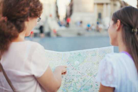 Tourists Looking for Places on a Map