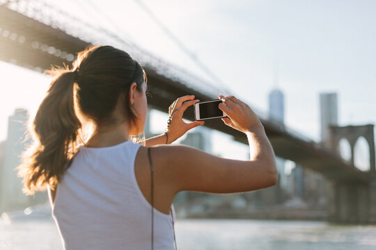 Woman taking a photo with a cell phone