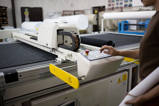 Man Operating a CNC Machine