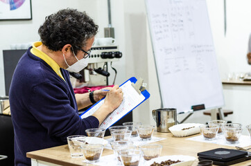 Professional coffee taster testing new smells and flavors