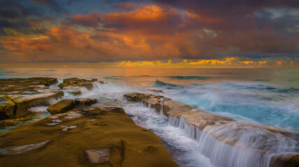 Beautiful Red Sunrise in La Jolla with waves
