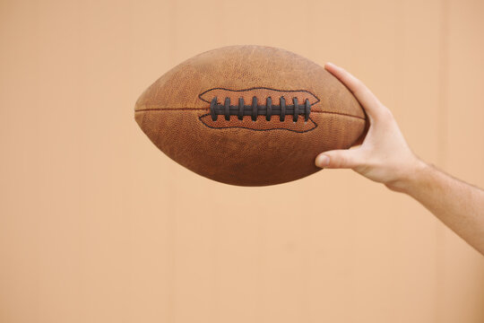 Holding Football