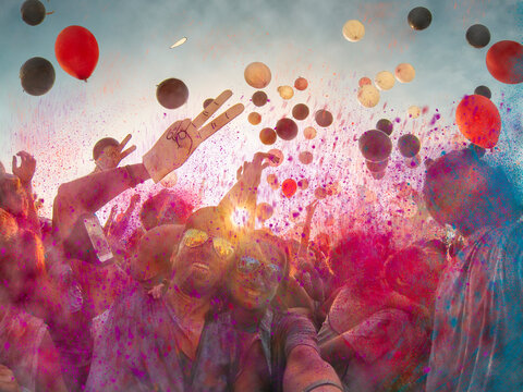 Couple in sunglasses taking a selfie at an outdoors at a concert