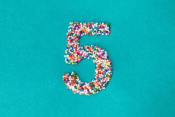 The number five built from nonpareils