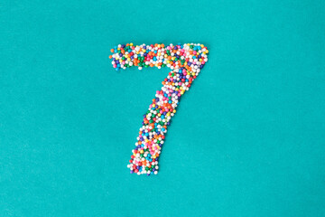 The number seven built from nonpareils