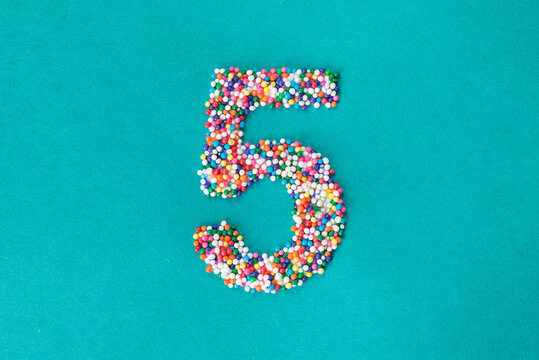 The number five built from nonpareils