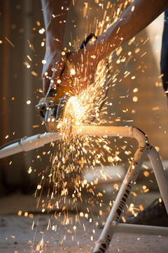 Builder plumber using grinder machine