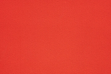 red rough wall in a sunny day as texture and background