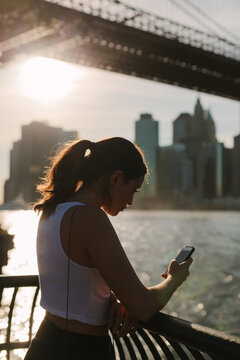 Young woman checking the cell phone