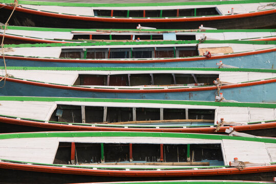 A row of boats tied to each other on the river Ganges in India.
