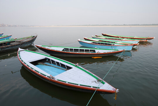 A row of boats tied to each other on the river Ganges in India.