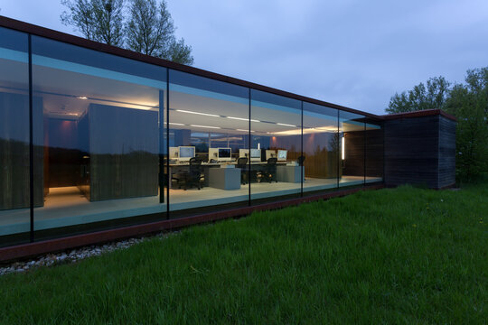 Glass facade of a modern office at twilight