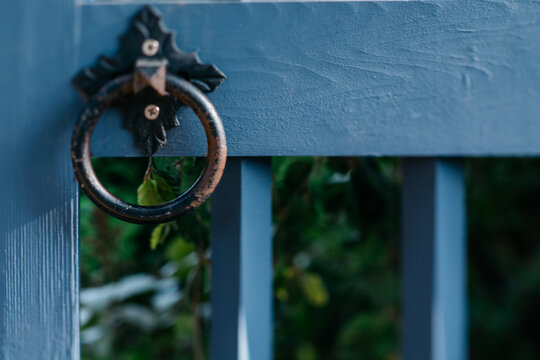 Ring handle on a blue outdoor gate