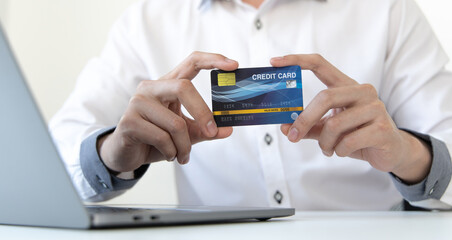 Online product purchase, Businessman use laptop register via credit cards to make online purchases, Shopping and mail, credit card online security, Online shopping concept.