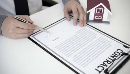 Sales manager or real estate agent will be prepared to show you a sample home and detail the terms of buying a home with insurance promotions, Attention to property services and insurance concept.